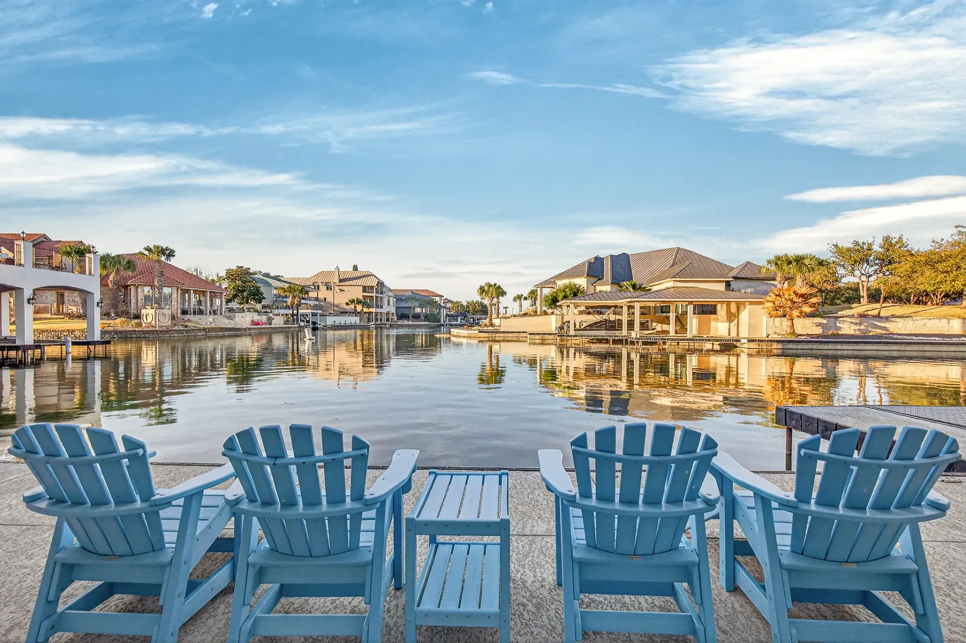 Waterfront Adirondack chairs at golden hour